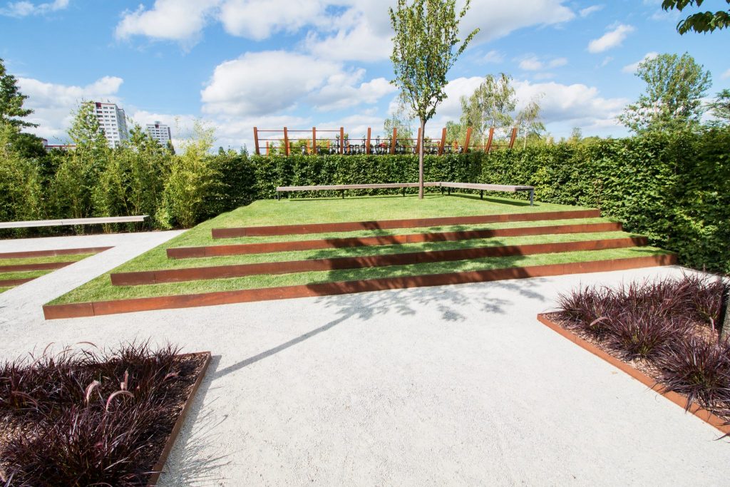 Landscaped garden with Corten steel terraced edging and lawn