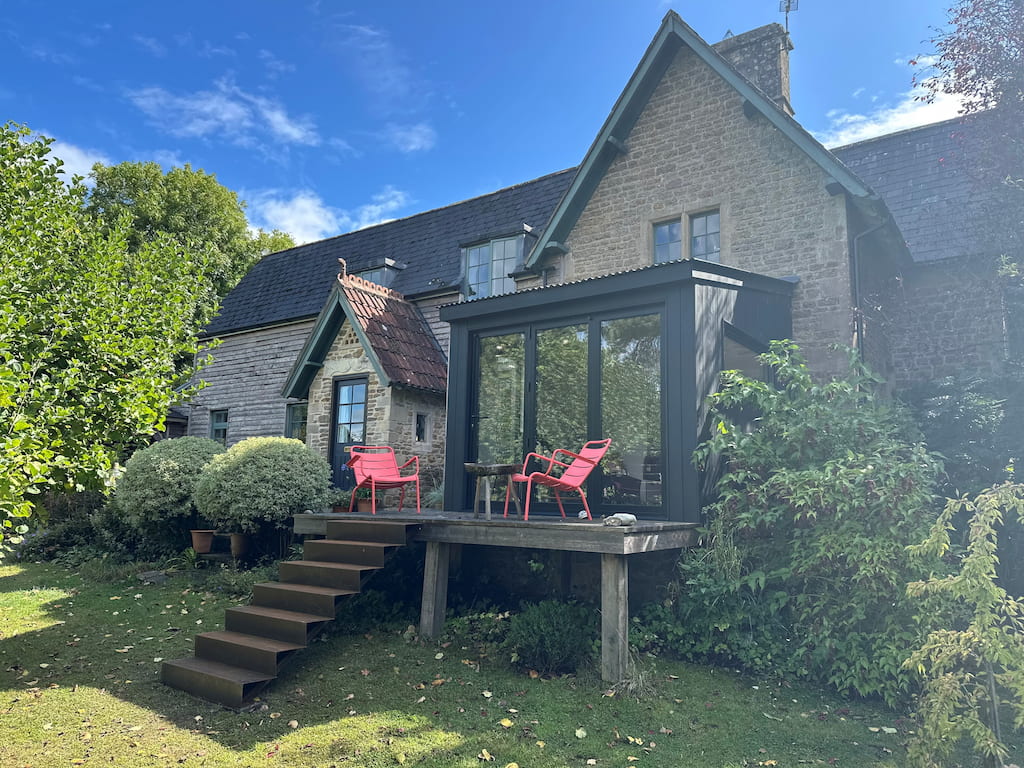 Corten stairs in garden Corten steel stairs in a garden setting with a wooden balcony