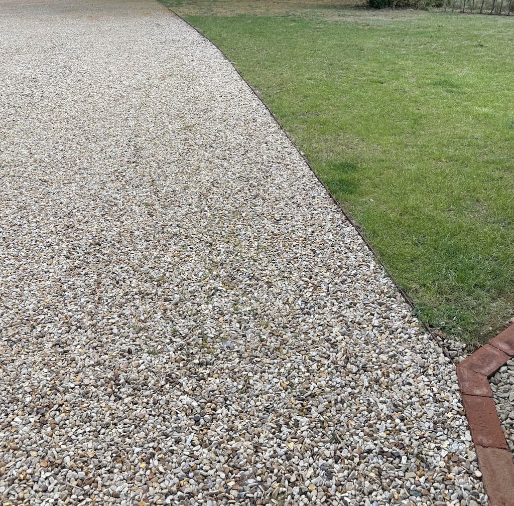 Steel edging with gravel border 2 Corten steel edging creating a gravel garden border